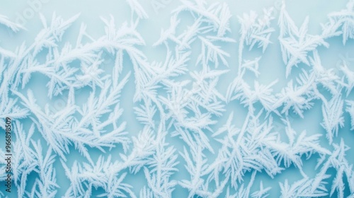 Close up view of captivating frost patterns and intricate ice crystal formations on a frozen window showcasing the natural beauty and scientific wonders of winter crystallization