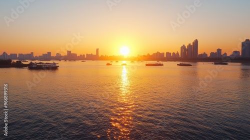 Golden Sunset Over City Skyline with Boats on Calm Water