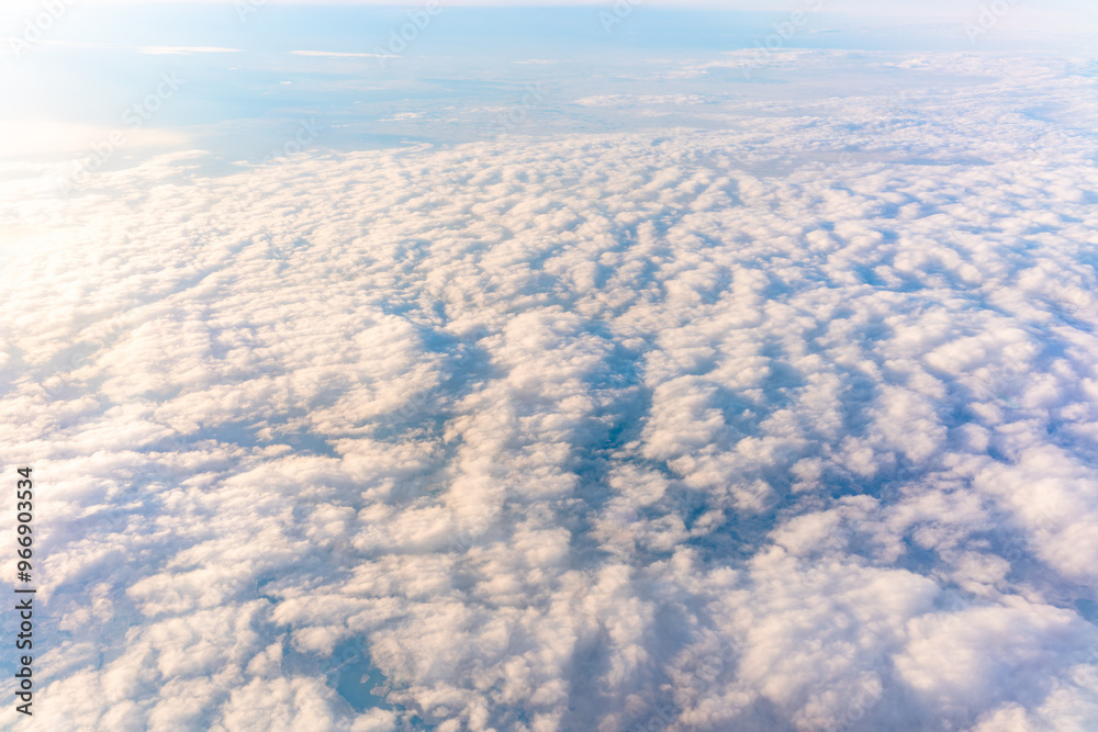 Beautiful orange and pink sunrise over the clouds, view from the plane. Beautiful orange and pink sunrise over the clouds, view from the plane.