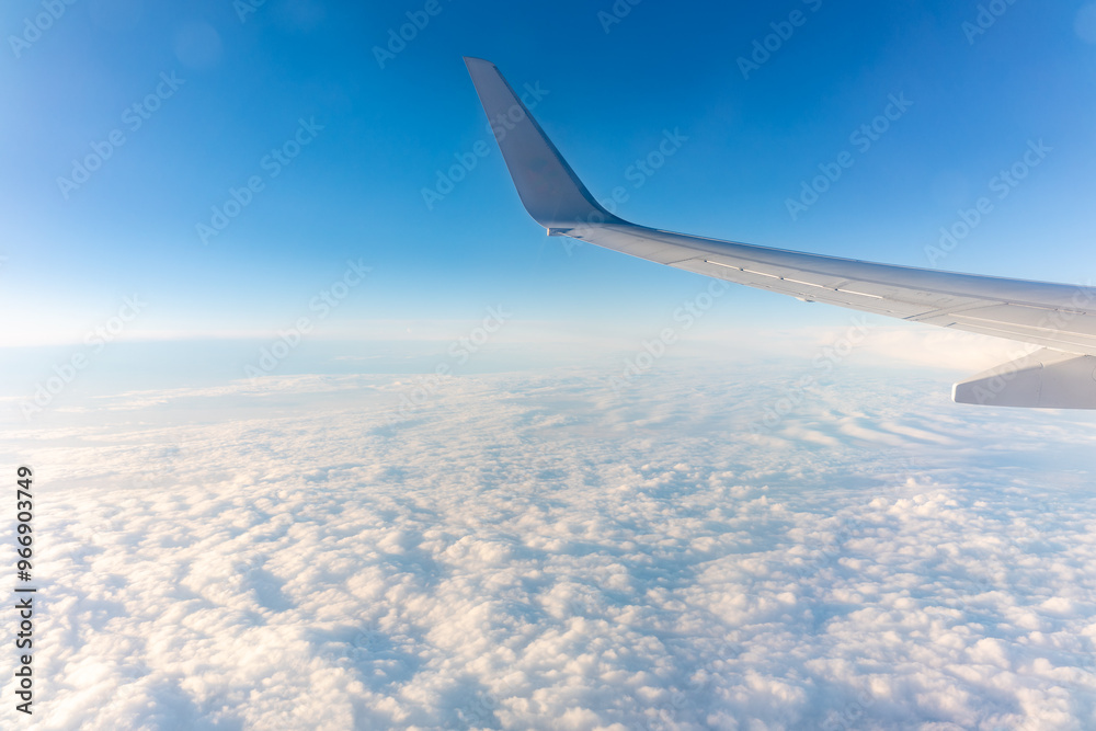Beautiful salmon dawn and the wing of an airplane above the clouds. Beautiful salmon dawn and the wing of an airplane above the clouds.