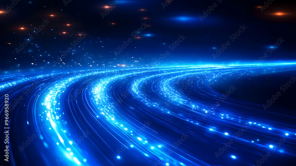 Fototapeta premium Abstract blue light trails with glowing particles creating a dynamic visual effect.