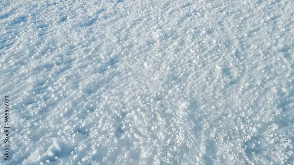 Top view video from above, flat lay with fresh, powdery snow and snowflake patterns covers the entire frame space. Top view video from above, flat lay with fresh, powdery snow and snowflake patterns covers the entire frame space.