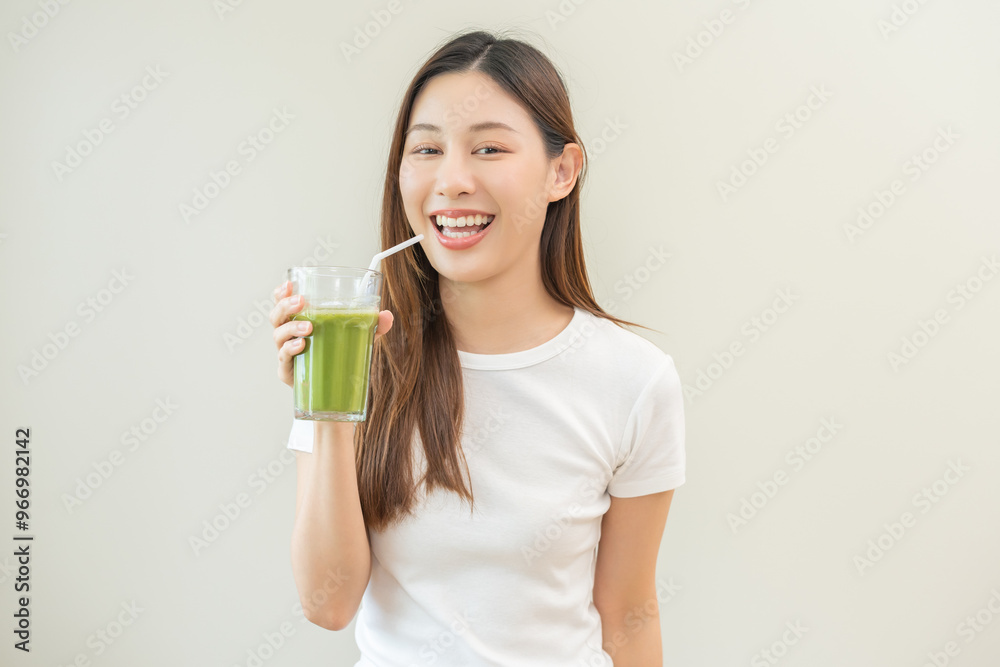Detox juice concept, smile asian young woman hand holding vegetable smoothie glass with straw for diet on background. Happy girl drinking healthy meal food for weight loss. Lifestyle, vegan nutrition. Detox juice concept, smile asian young woman hand holding vegetable smoothie glass with straw for diet on background. Happy girl drinking healthy meal food for weight loss. Lifestyle, vegan nutrition.