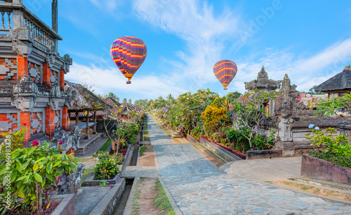 Hot air balloon flying over Penglipuran is a traditional oldest Bali village at Bangli Regency - Bali, Indonesia   photo