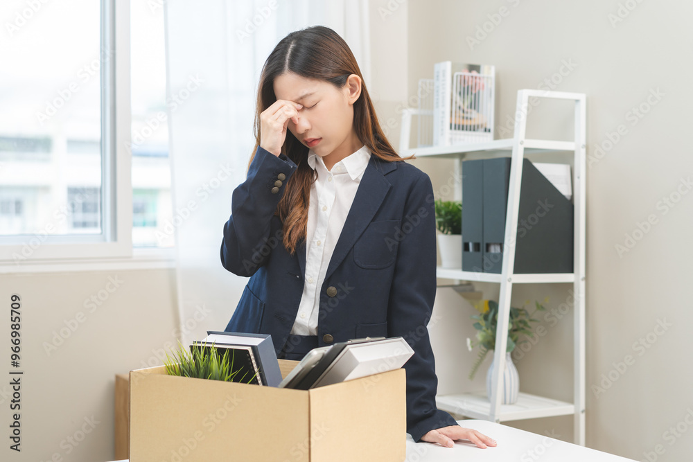 Stressed of unemployment, quitting job concept, desperate asian young business woman resigning or fired, leave from company, take belongings, stuff into box cardboard, layoff or leaving, changing work Stressed of unemployment, quitting job concept, desperate asian young business woman resigning or fired, leave from company, take belongings, stuff into box cardboard, layoff or leaving, changing work
