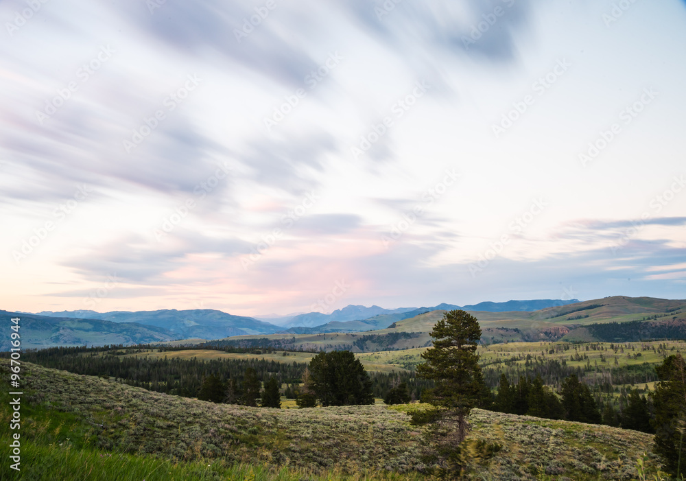 Sunset over rolling hills and valleys in Yellowstone National Park. Sunset over rolling hills and valleys in Yellowstone National Park.