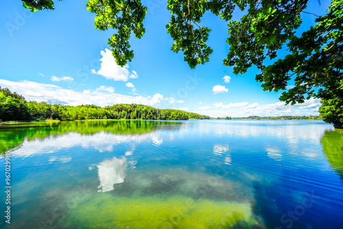 View of Seehamer See and the surrounding landscape in the municipality of Weyarn near Munich. Idyllic nature by the lake with turquoise water.
 photo