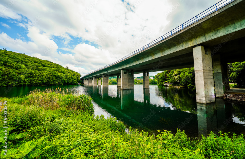 View of nature and the Seilersee near Iserlohn with the A46 bridge. Callerbachtalsperre with the surrounding landscape.
View of nature and the Seilersee near Iserlohn with the A46 bridge. Callerbachtalsperre with the surrounding landscape.