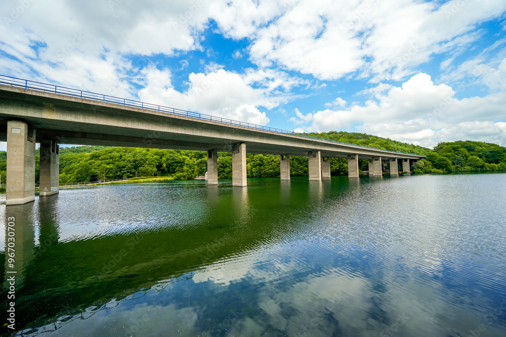 View of nature and the Seilersee near Iserlohn with the A46 bridge. Callerbachtalsperre with the surrounding landscape.
View of nature and the Seilersee near Iserlohn with the A46 bridge. Callerbachtalsperre with the surrounding landscape.