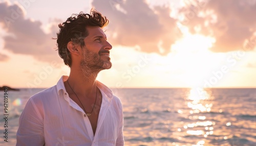 Sunset Serenity: Handsome Man Embracing the Ocean's Beauty on Vacation