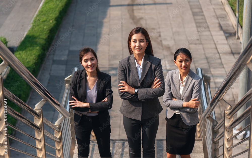 Team leadership businesswoman walking together on street city life. Group of business people team leader woman power. Multiethnic asian people step up urban lifestyle. Crowd Women walking up stair Team leadership businesswoman walking together on street city life. Group of business people team leader woman power. Multiethnic asian people step up urban lifestyle. Crowd Women walking up stair