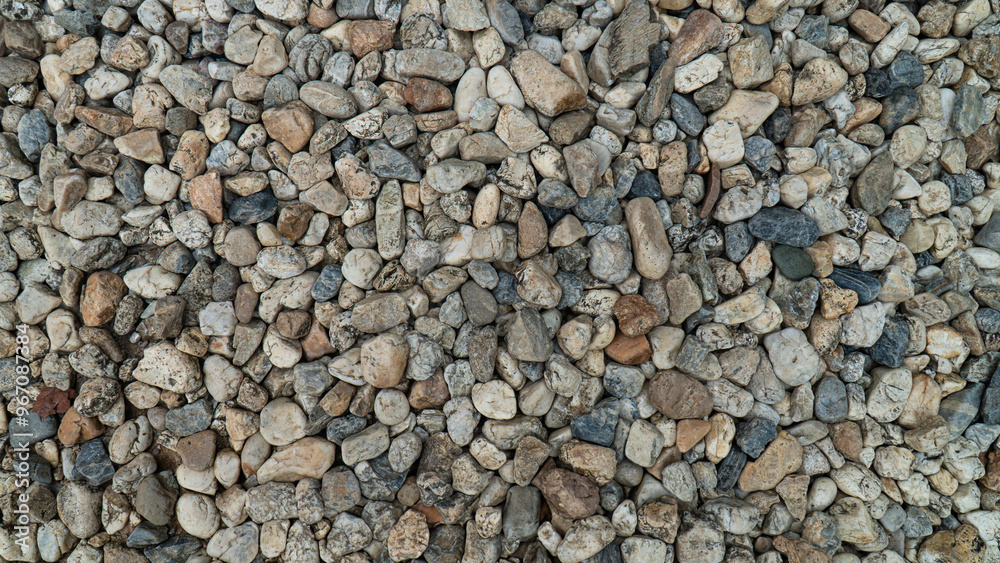 High-resolution close-up image of small pebbles and stones in various shades of gray and brown, ideal for use in backgrounds or textures. High-resolution close-up image of small pebbles and stones in various shades of gray and brown, ideal for use in backgrounds or textures.
