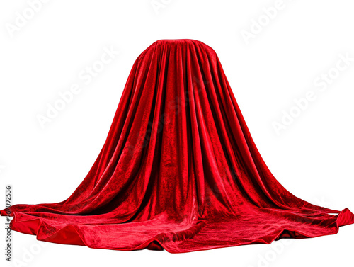 a red velvet covered object with Devils Tower in the background