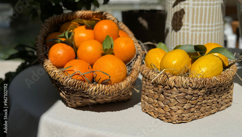 Oranges and lemons fruits in baskets. 