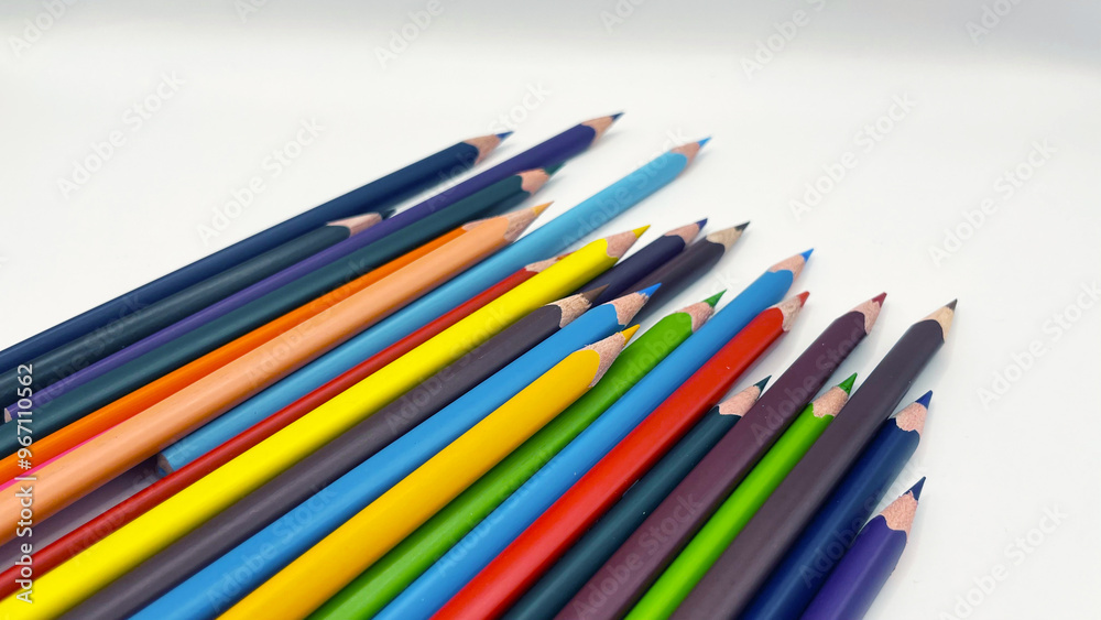 Colorful sharpened pencils are lined up on the table. Colorful sharpened pencils are lined up on the table.