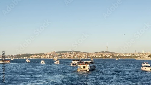 People walking from Galata Bridge to Eminönü on the Bosphorus in Istanbul, Turkey photo