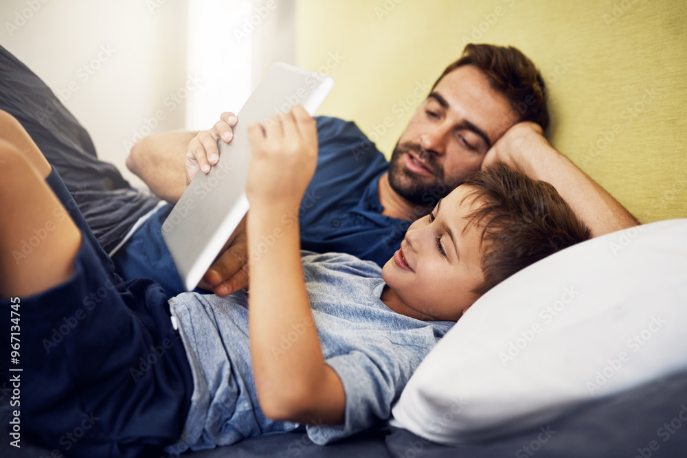 Game, relax or tablet with father and son in bedroom of home together for bonding or playing. App, streaming or video with single parent man and boy kid resting on bed in apartment for entertainment Game, relax or tablet with father and son in bedroom of home together for bonding or playing. App, streaming or video with single parent man and boy kid resting on bed in apartment for entertainment
