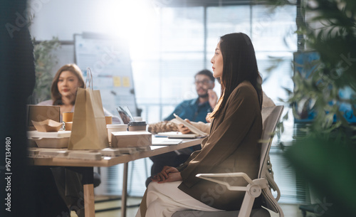 Business asian woman sitting in office meeting presentation ESG and technology innovations recycle material for sustainable product
