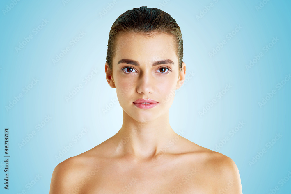 Beauty, aesthetic and portrait of woman in studio for cosmetics, collagen and facial. Self care, glow and shine with face of female model on blue background for clean, natural skincare and spa mockup