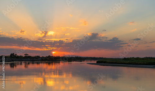 Picturesque sunset on the Ili River in the vicinity of the Kazakh city of Almaty on an autumn evening