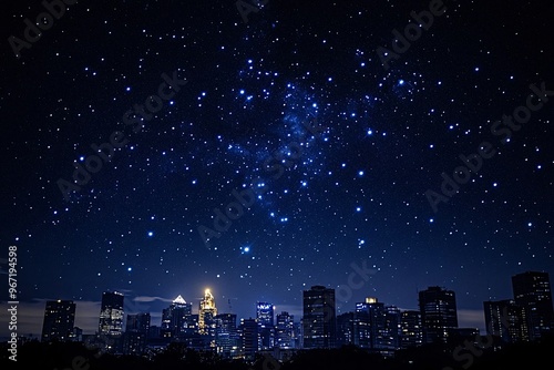 Wallpaper Mural The milky way shines brightly over a city, casting a magical glow on buildings below, illuminating the urban landscape with twinkling stars in the dark blue sky Torontodigital.ca