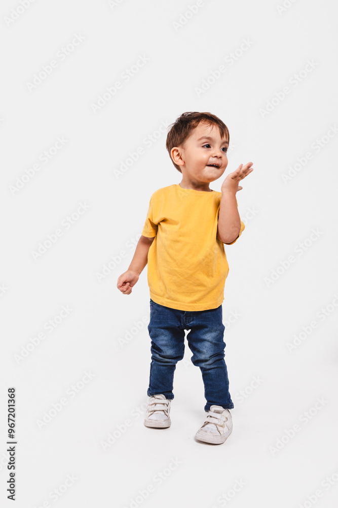 Portrait of a two-year-old boy kissing the air on white background Portrait of a two-year-old boy kissing the air on white background