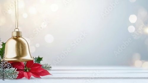 A gleaming golden bell adorned with red ribbon, poinsettia, and holly leaves captures the essence of Christmas cheer and festive spirit photo