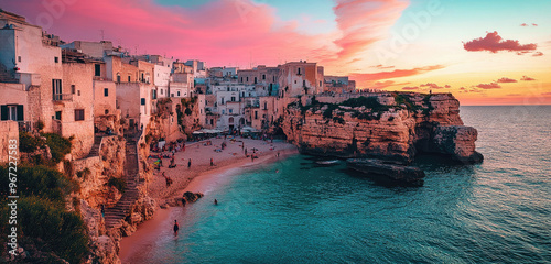 Bagnolo Puglia in Puglia, Italy with the sea and cliffside buildings at sunset. photo