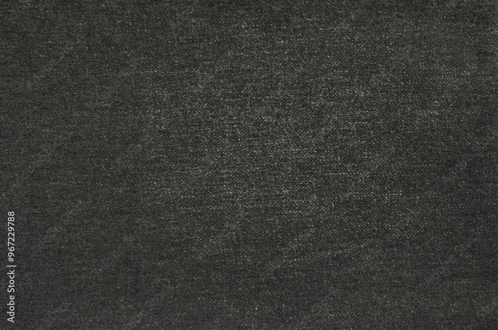Natural fabric texture background. Simple and basic pattern textile. Black colored cloth surface closeup. Natural fabric texture background. Simple and basic pattern textile. Black colored cloth surface closeup.