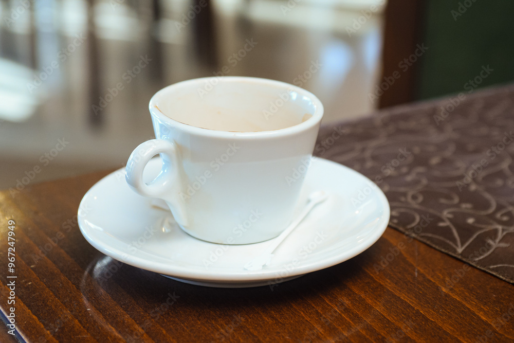Empty coffee cup on the table in the restaurant Empty coffee cup on the table in the restaurant