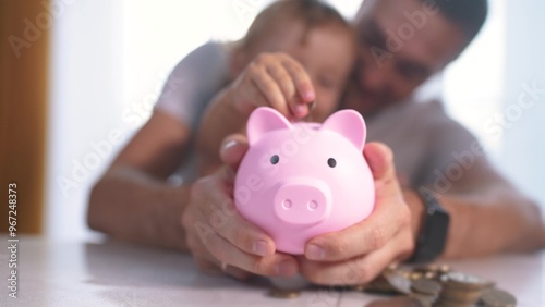 Bild auf Leinwand Child is playing with piggy bank full of coins