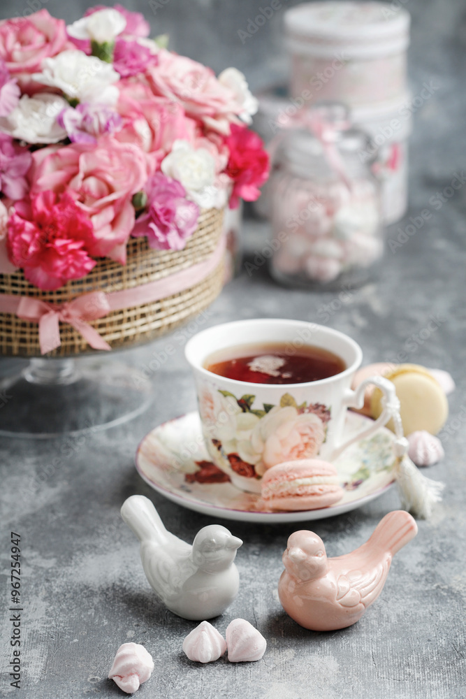 Fototapeta premium Florist at work. How to make floral decorations on summer party table. Centerpiece with rose and carnation flowers. Romantic wedding reception. Step by step, diy.
