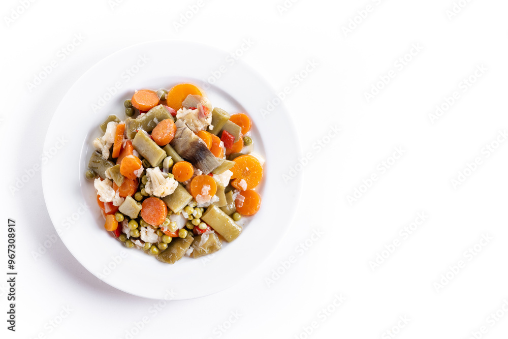 vegetable stew (menestra de verduras) on a plate isolated on white background. Top view. Copy space vegetable stew (menestra de verduras) on a plate isolated on white background. Top view. Copy space