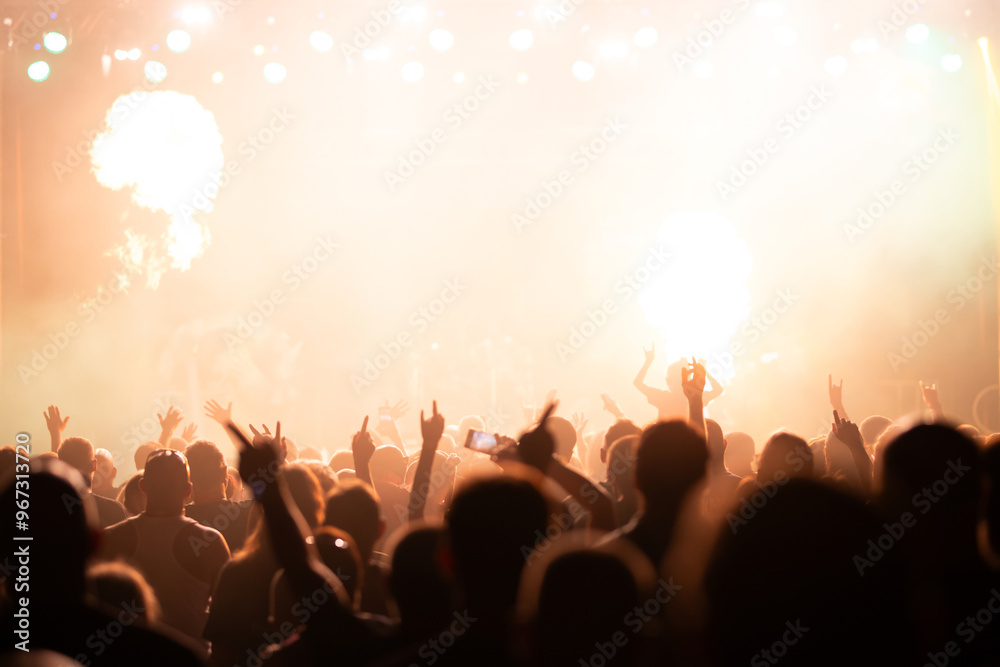 Fototapeta premium Crowd at concert and colorful stage lights.