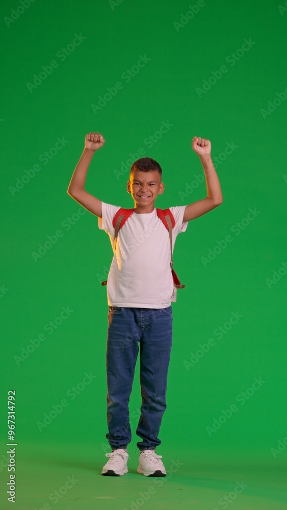 Victorious Schoolboy Celebrating on Green Screen