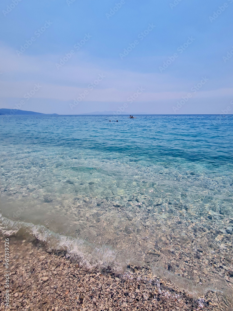 Beautiful beach in Borsh, Albania with sun umbrellas and sunbeds. Perfect summer vacation destination. Beautiful beach in Borsh, Albania with sun umbrellas and sunbeds. Perfect summer vacation destination.