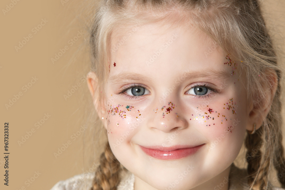 Portrait of cute little blonde girl with boxer braids and glitters on face Portrait of cute little blonde girl with boxer braids and glitters on face