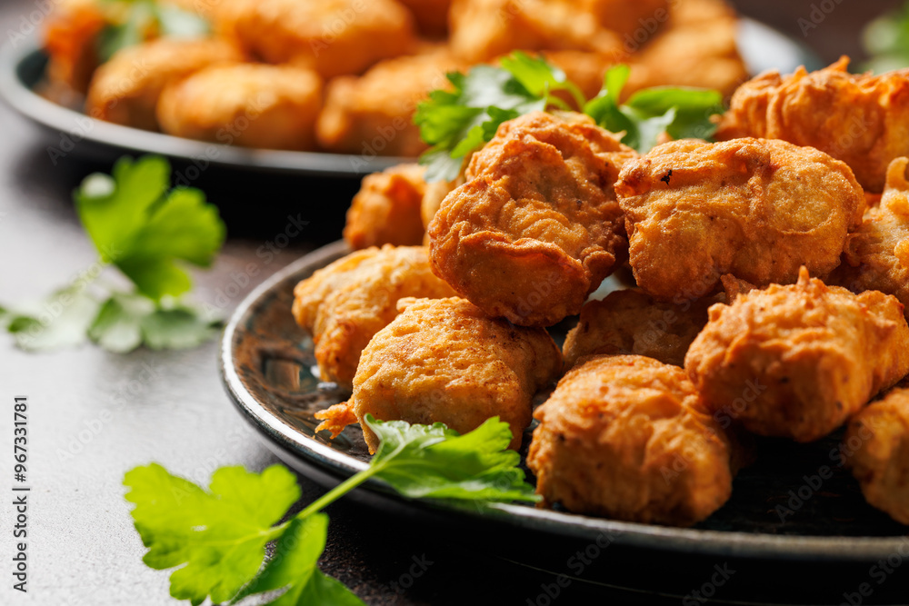 Homemade crispy fried chicken nuggets served with ketchup Homemade crispy fried chicken nuggets served with ketchup