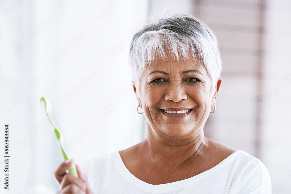 Brushing teeth, portrait and smile of mature woman in bathroom of home for dental hygiene. Face, toothbrush and toothpaste with happy senior person in apartment for morning oral care routine Brushing teeth, portrait and smile of mature woman in bathroom of home for dental hygiene. Face, toothbrush and toothpaste with happy senior person in apartment for morning oral care routine