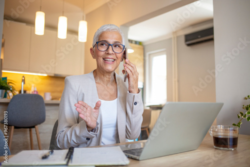 Senior Businesswoman Working From Home on Phone Call photo