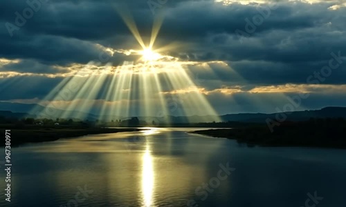 Sunbeams Through the Clouds over a River