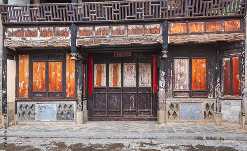 Dilapidated facade at the courtyard of a historic house in the historic town of Tuanshan, Yunnan province China
 photo