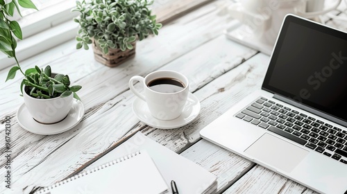 Home Office Workspace with Laptop, Coffee Cup, and Green Plants on Wooden Desk