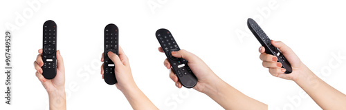 Fotografie Hand holding television remote isolated on white background.