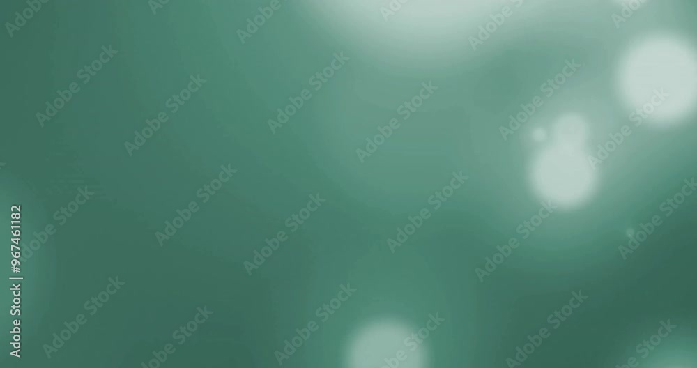 Animation of glowing light spots moving over green background