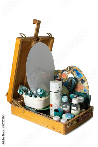 vintage  box easel with art materials for painting on a white background.