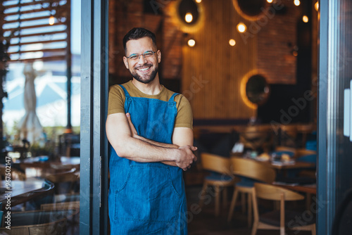 Smiling Cafe Owner Standing Proudly in Doorway
