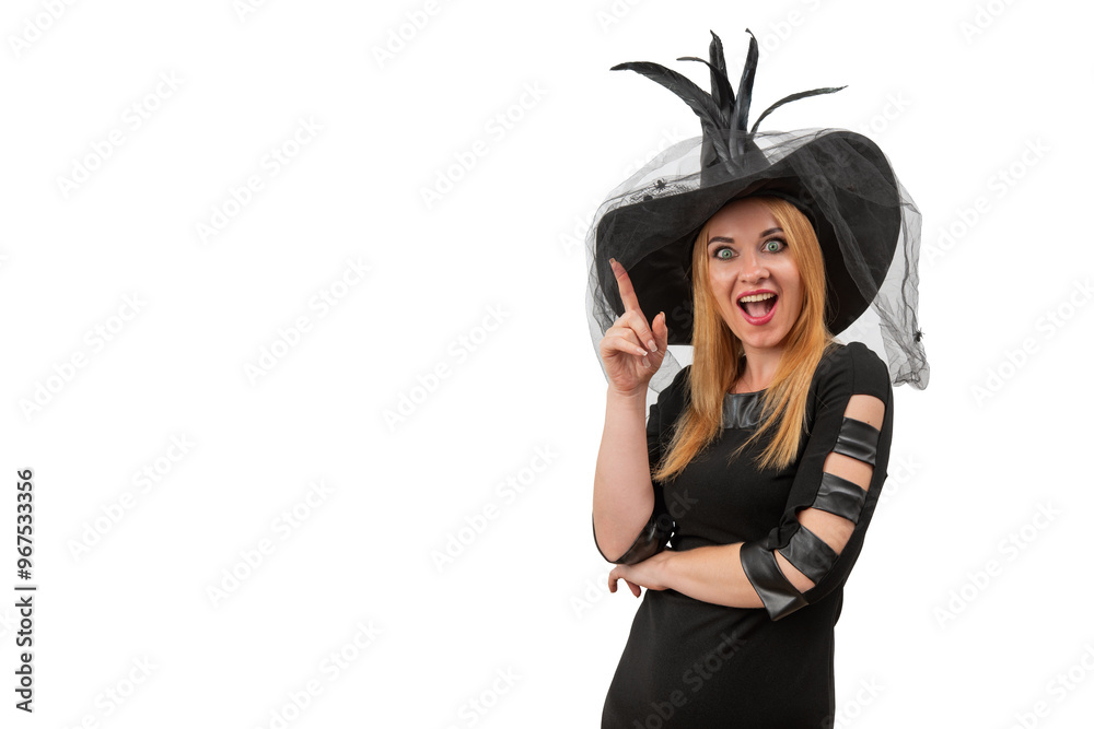 Beautiful woman in a black witch hat looks at the camera with delight and surprise. Halloween costume, white background, space for text Beautiful woman in a black witch hat looks at the camera with delight and surprise. Halloween costume, white background, space for text