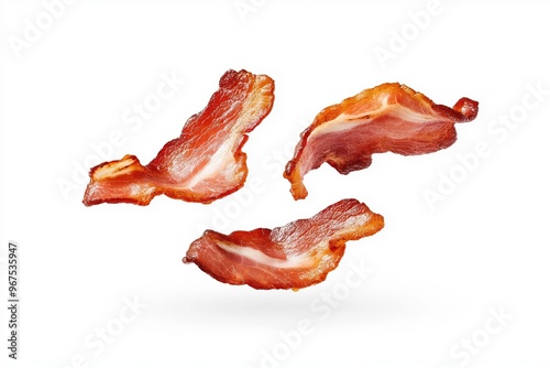 Crispy fried bacon rashers falling in the air