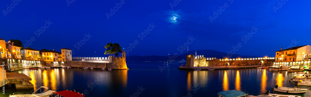 Panorama of famous port in Nafpaktos in Greece during blue hour.